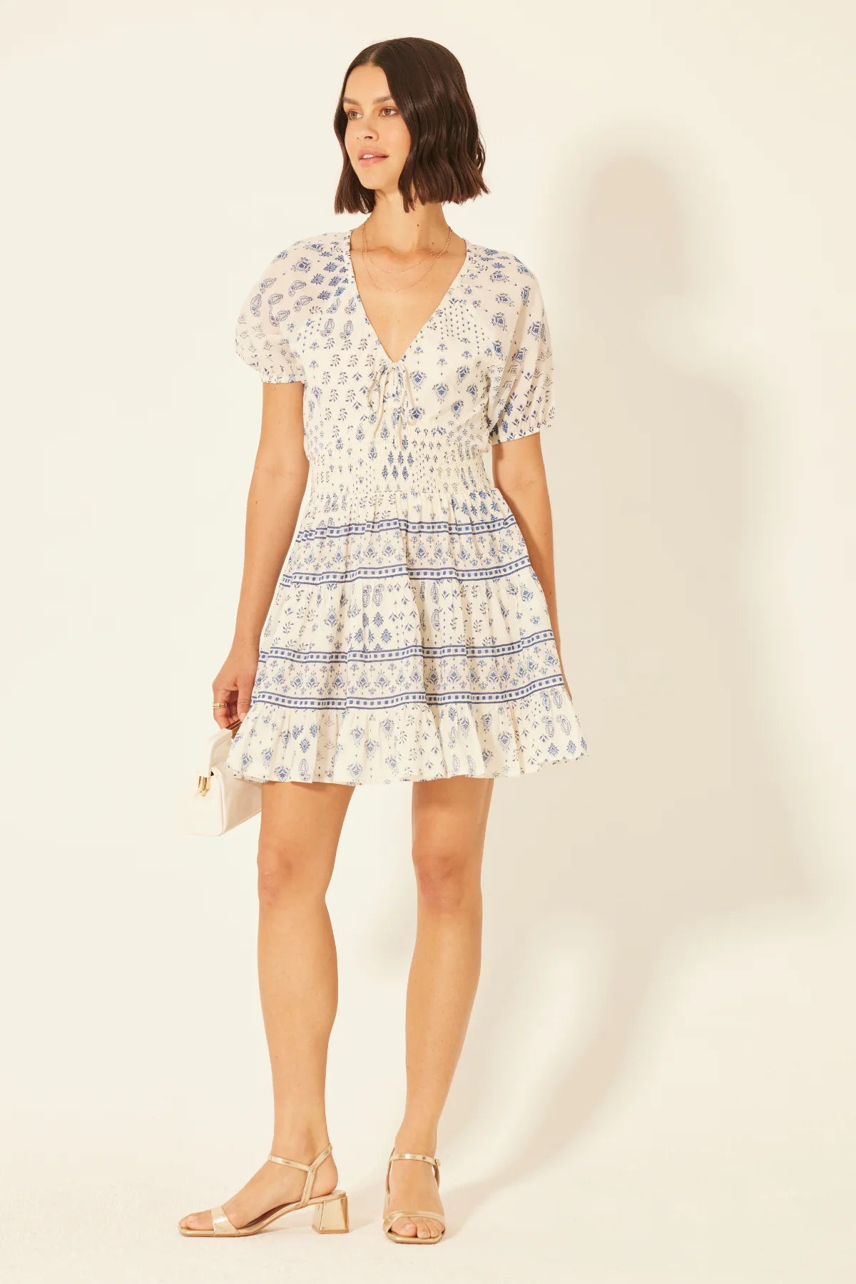 mini length dress, v neckline, ivory with blue floral pattern