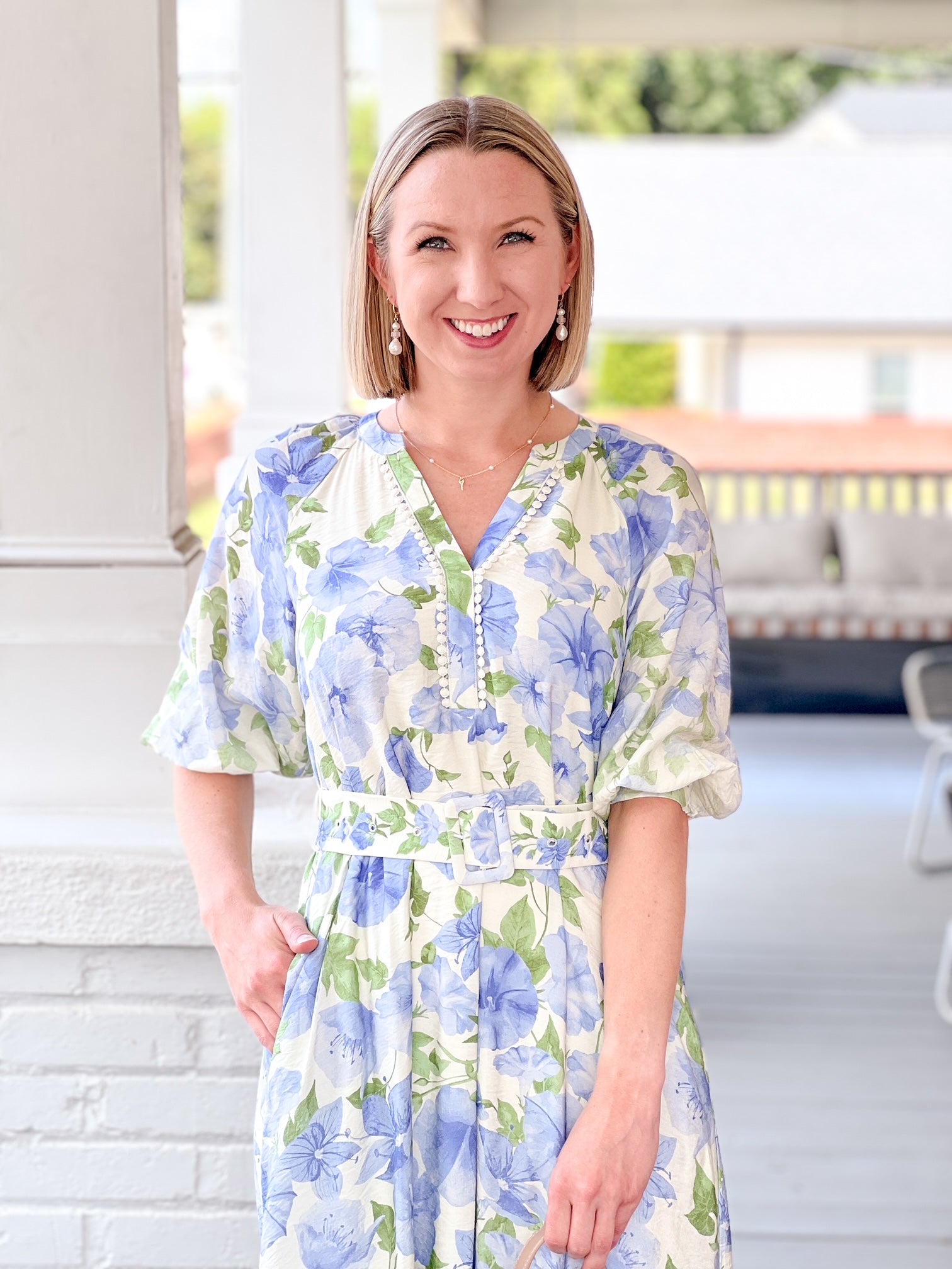 blue floral dress with short sleeves, matching belt, in a midi length