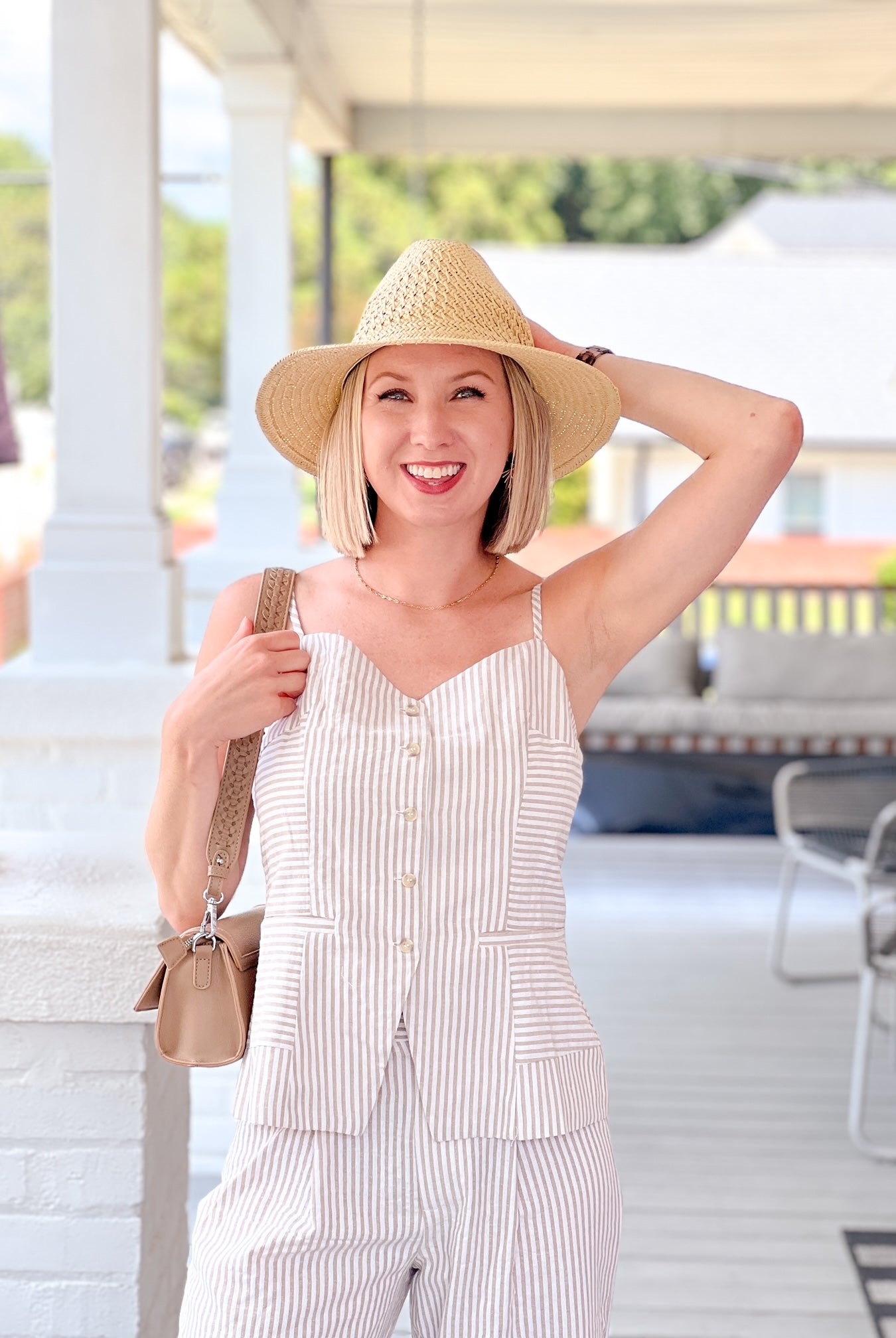 sleeveless striped top with v neckline and front button detail