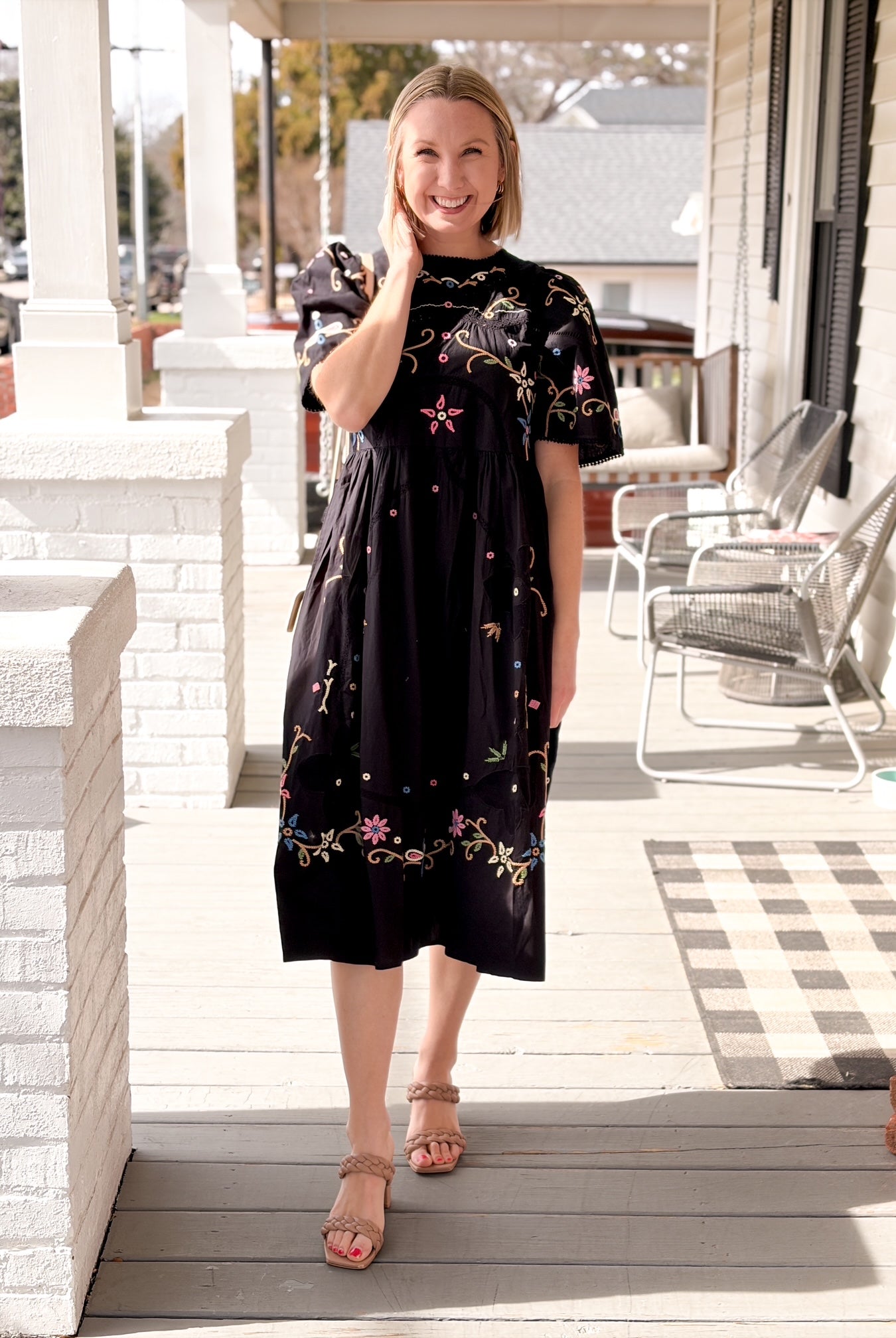black midi length short sleeve dress with colorful embroidery