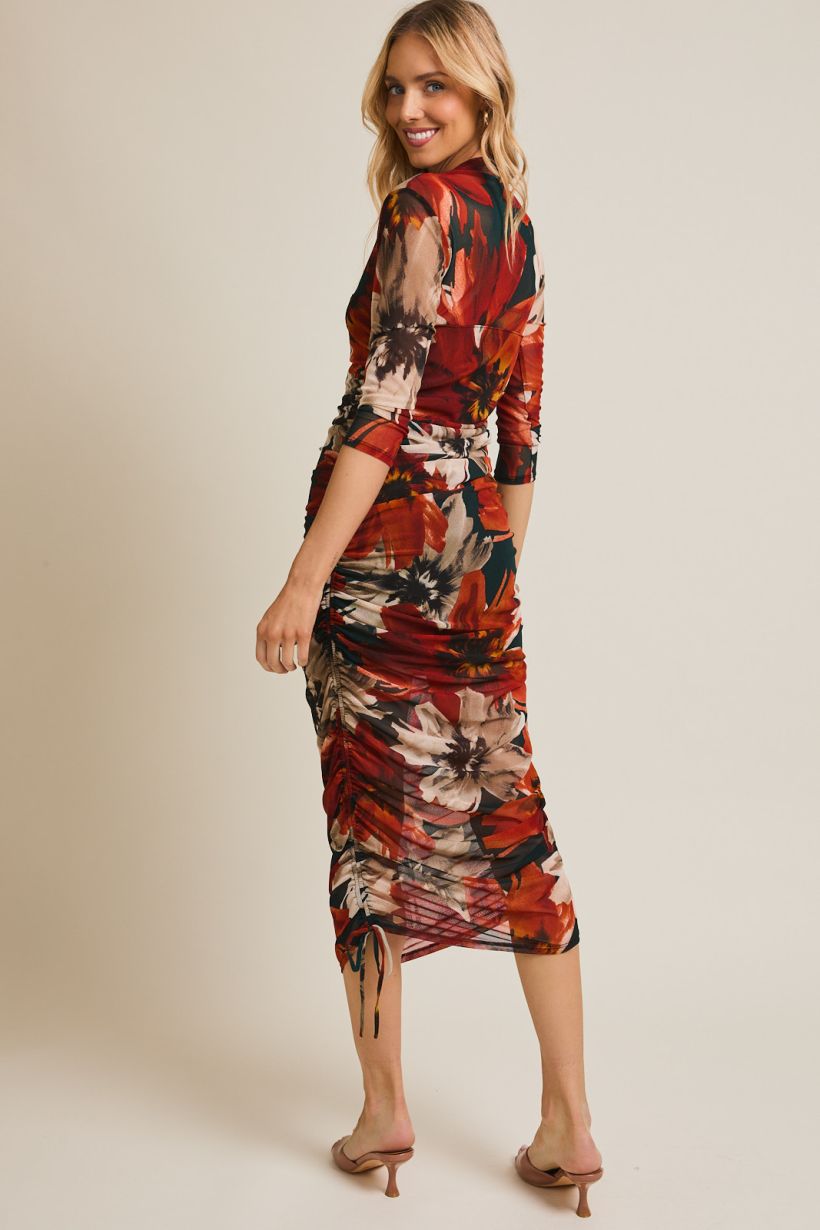 midi length orange, black and cream dress with 3/4 sleeves