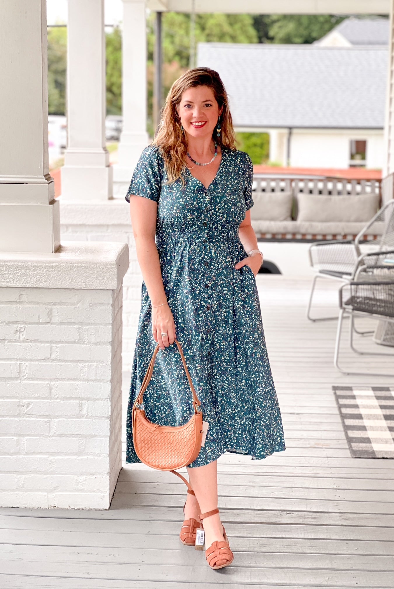midi length a line dress with v neckline, teal floral pattern, short sleeves