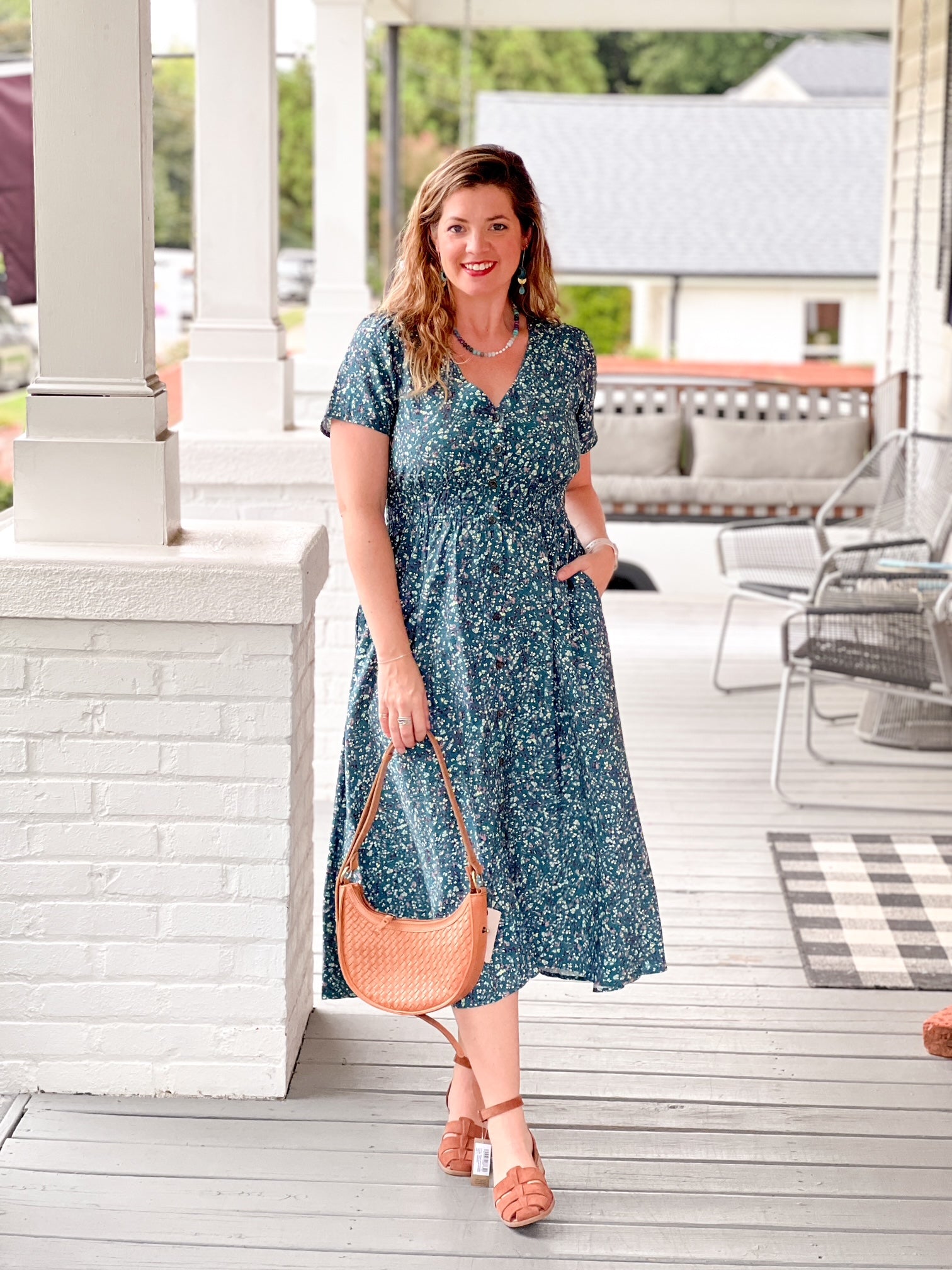 midi length a line dress with v neckline, teal floral pattern, short sleeves