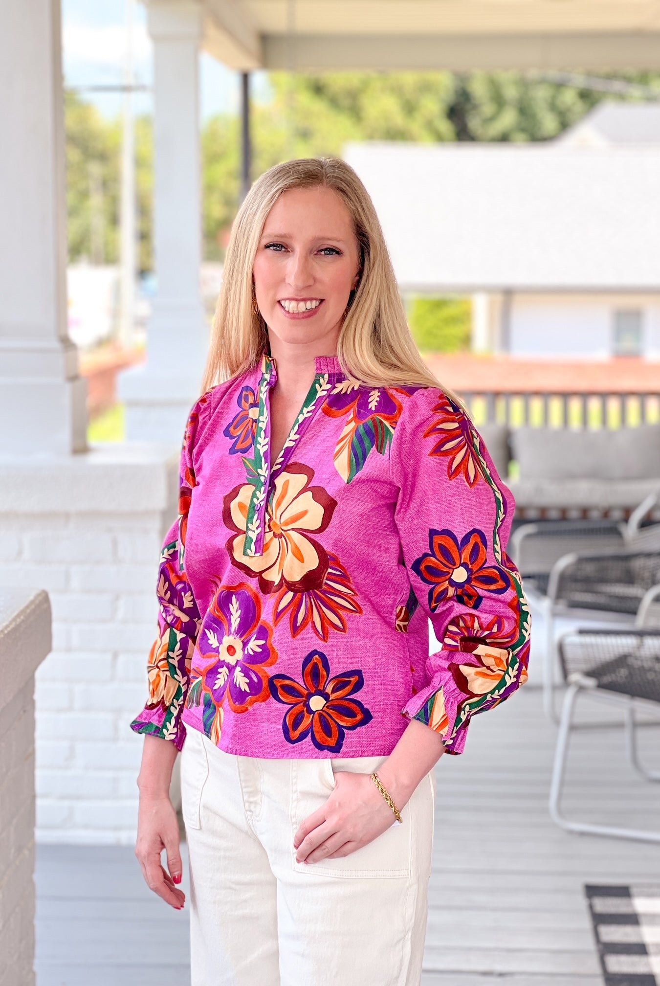 long sleeve work top with v neckline, bright purple pattern with floral