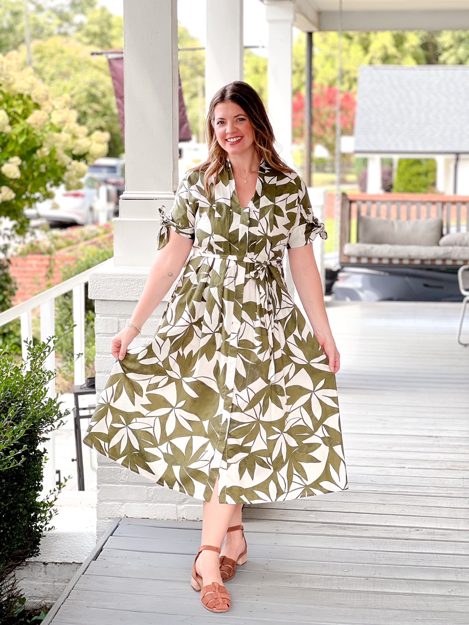 olive green dress with short sleeves, midi length, leaf pattern