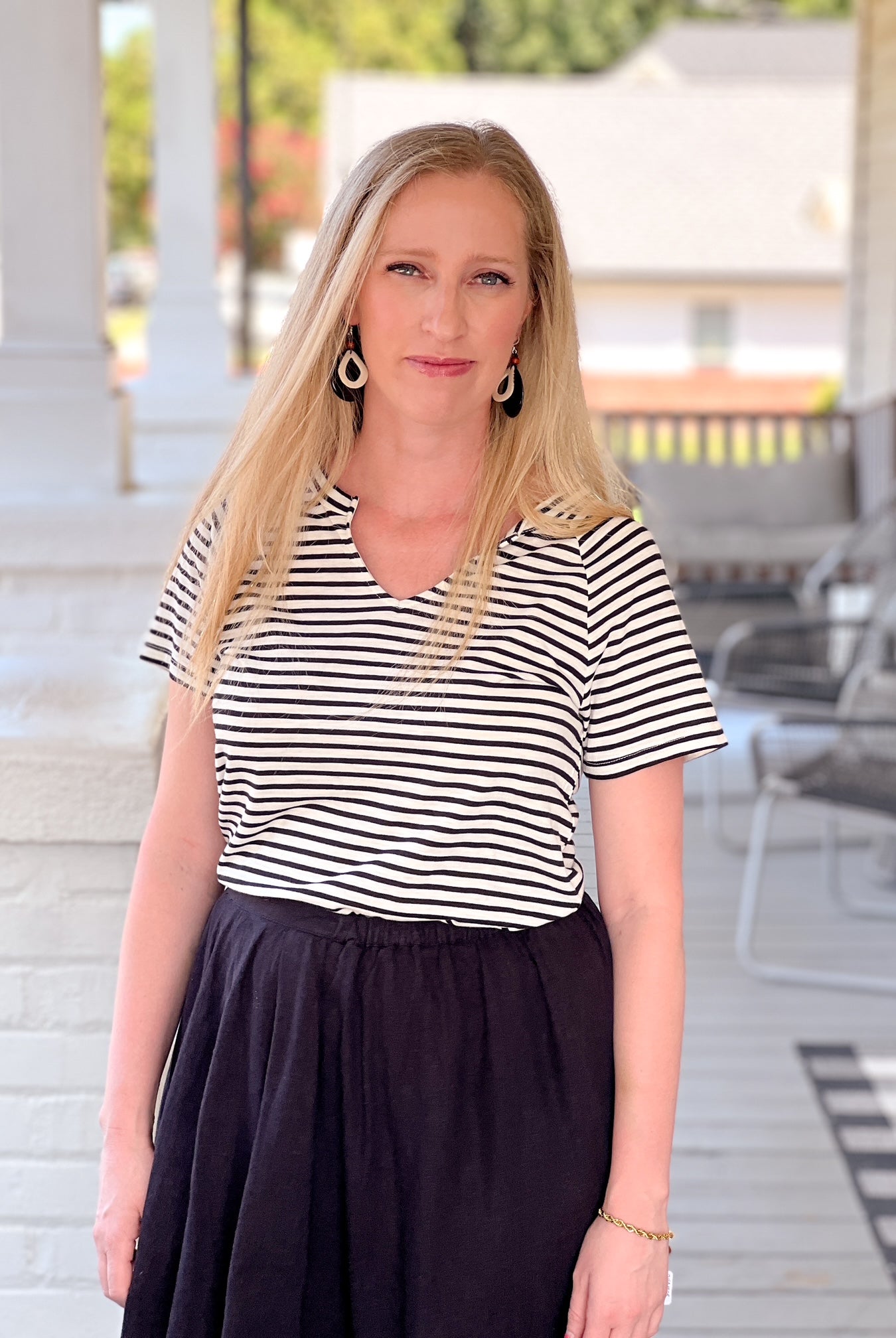 short sleeve shirt with black and white stripes and v neckline