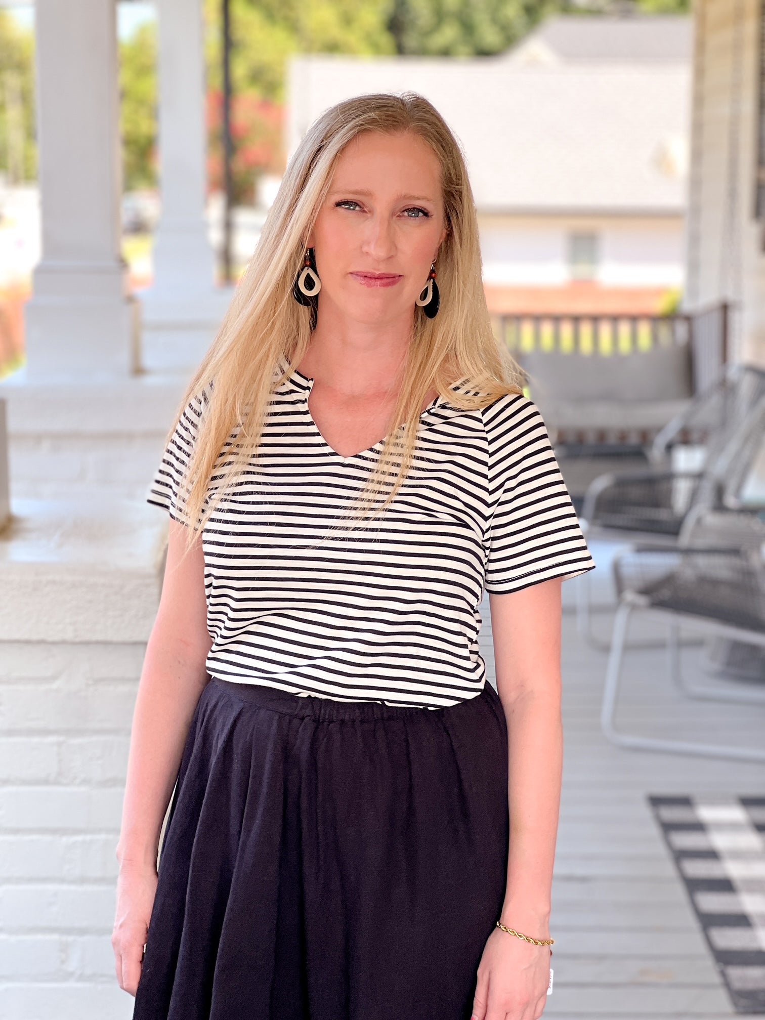 short sleeve shirt with black and white stripes and v neckline