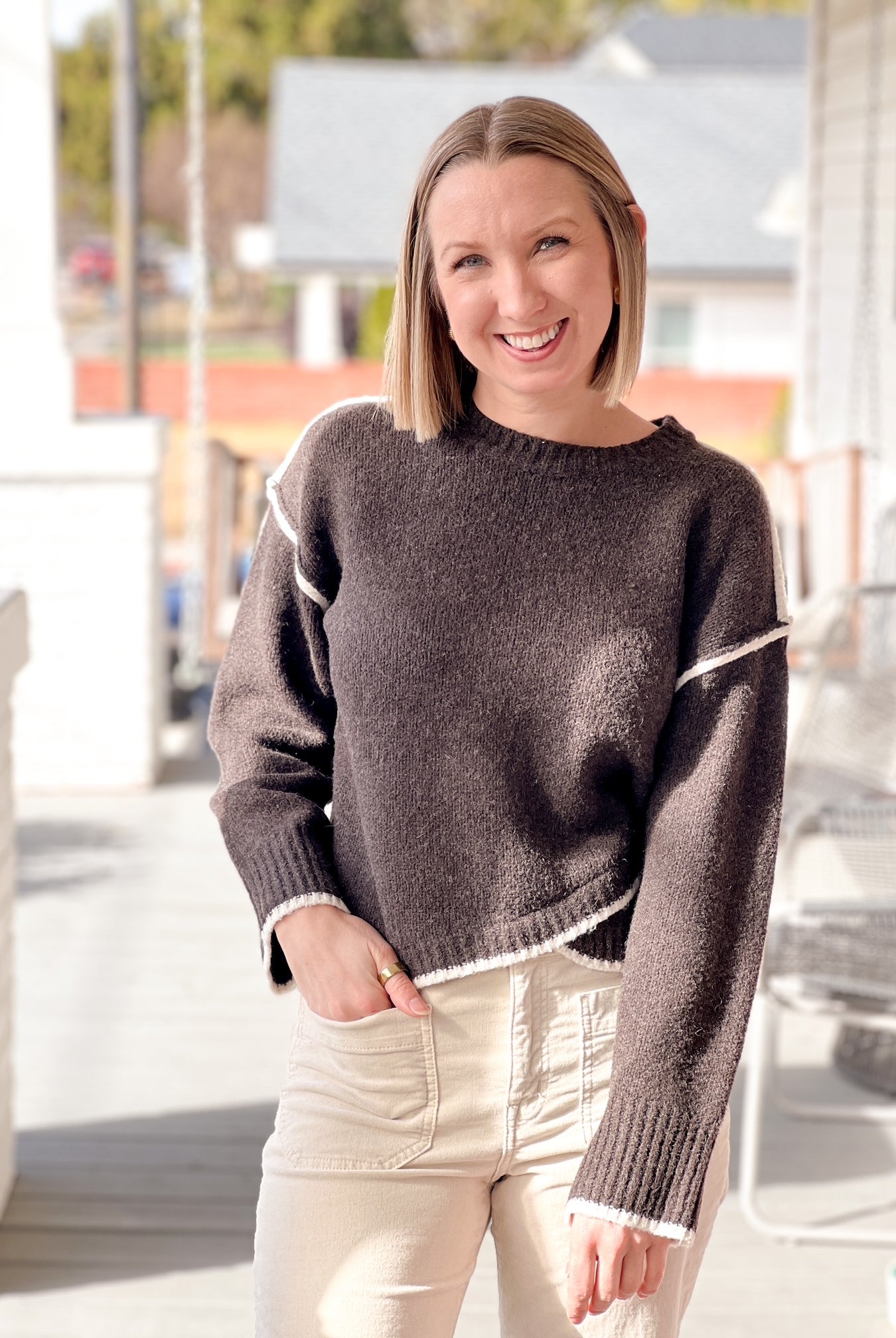 long sleeve brown cardigan with crew neckline and contrasting hem