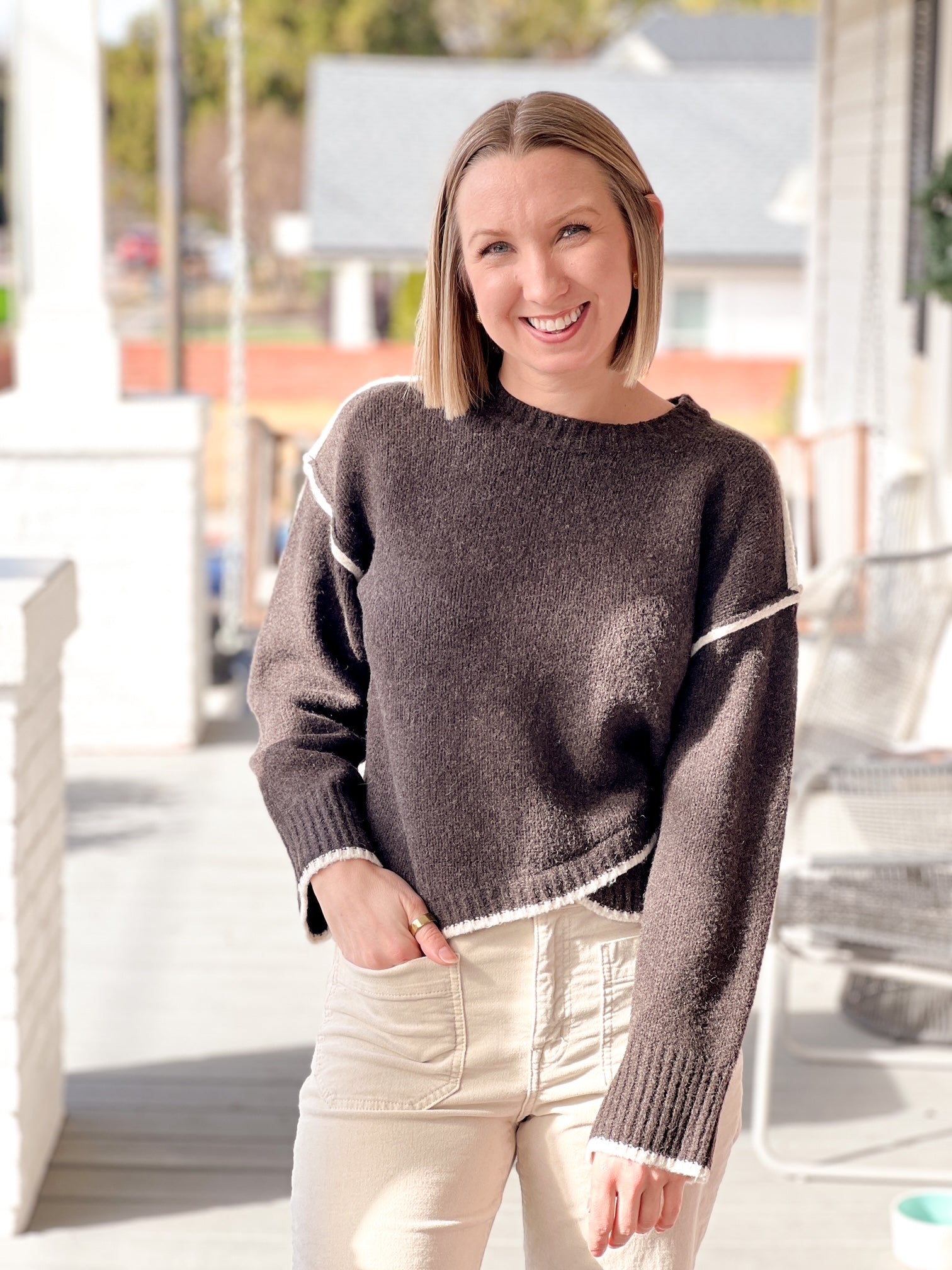 long sleeve brown cardigan with crew neckline and contrasting hem