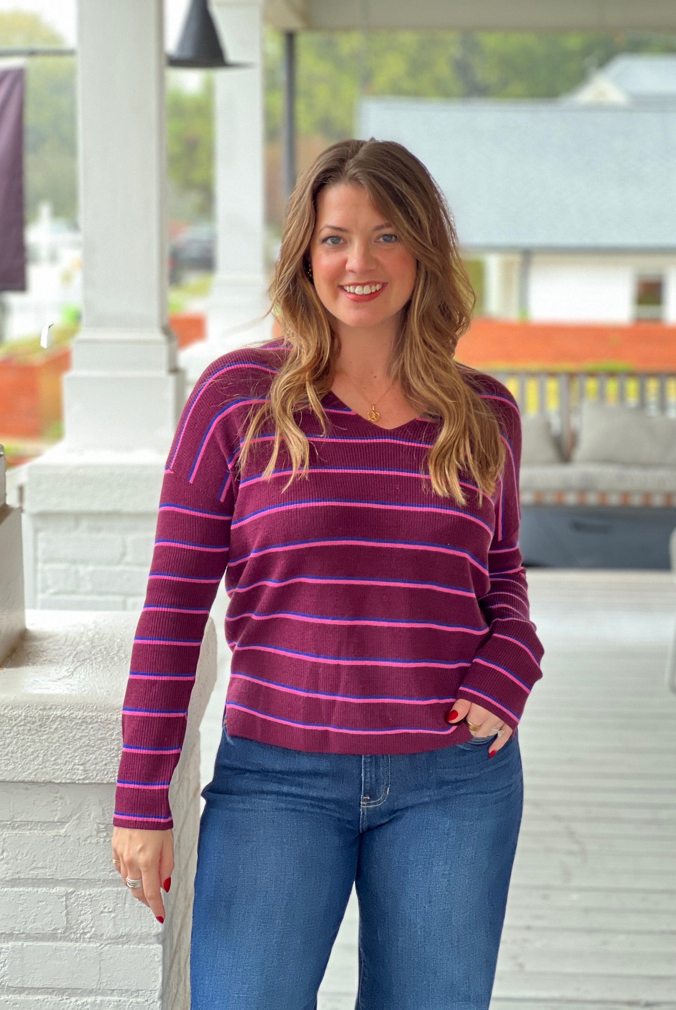 wine sweater with v neckline and long sleeves, small stripes