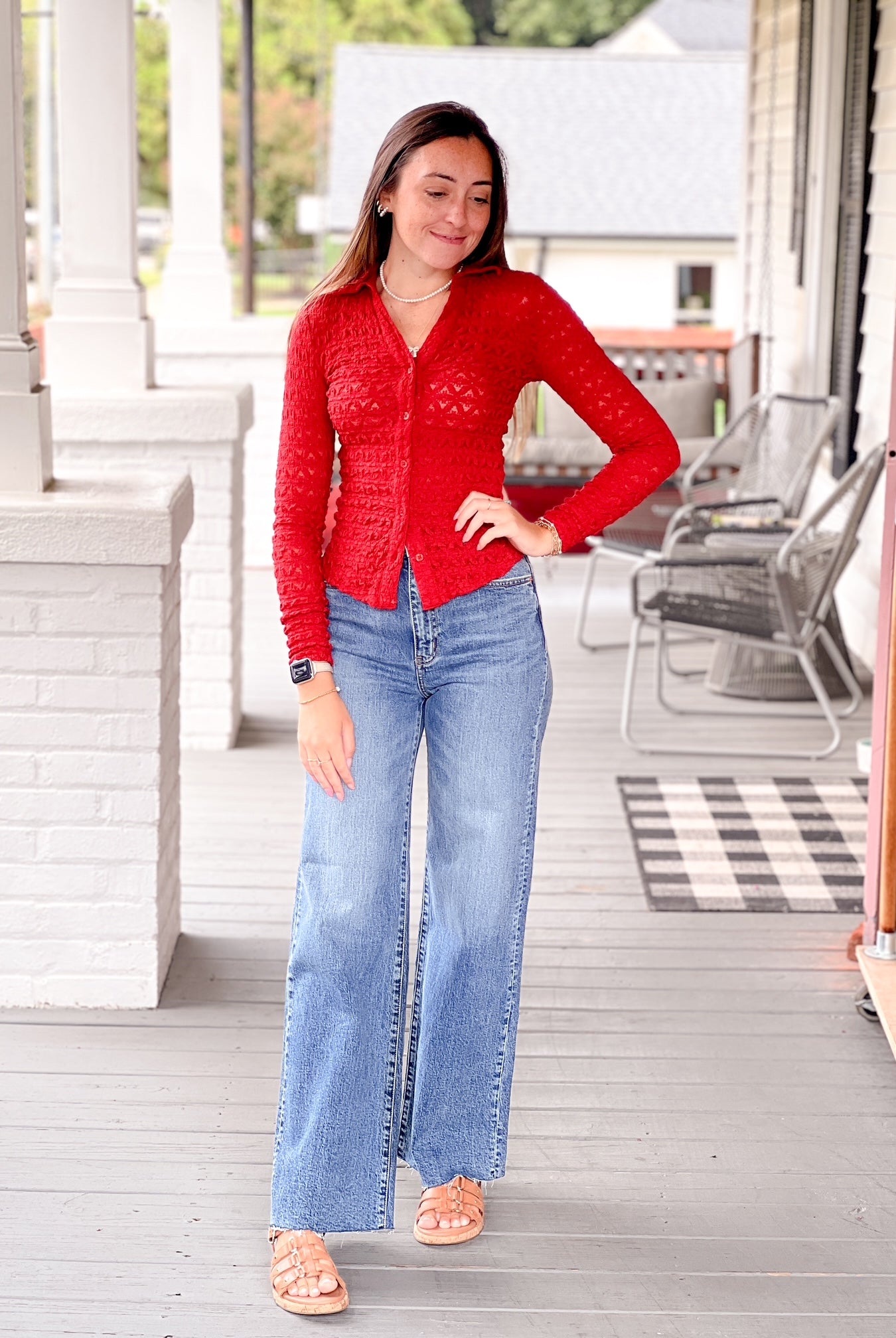 red long sleeve collared v neckline button front top