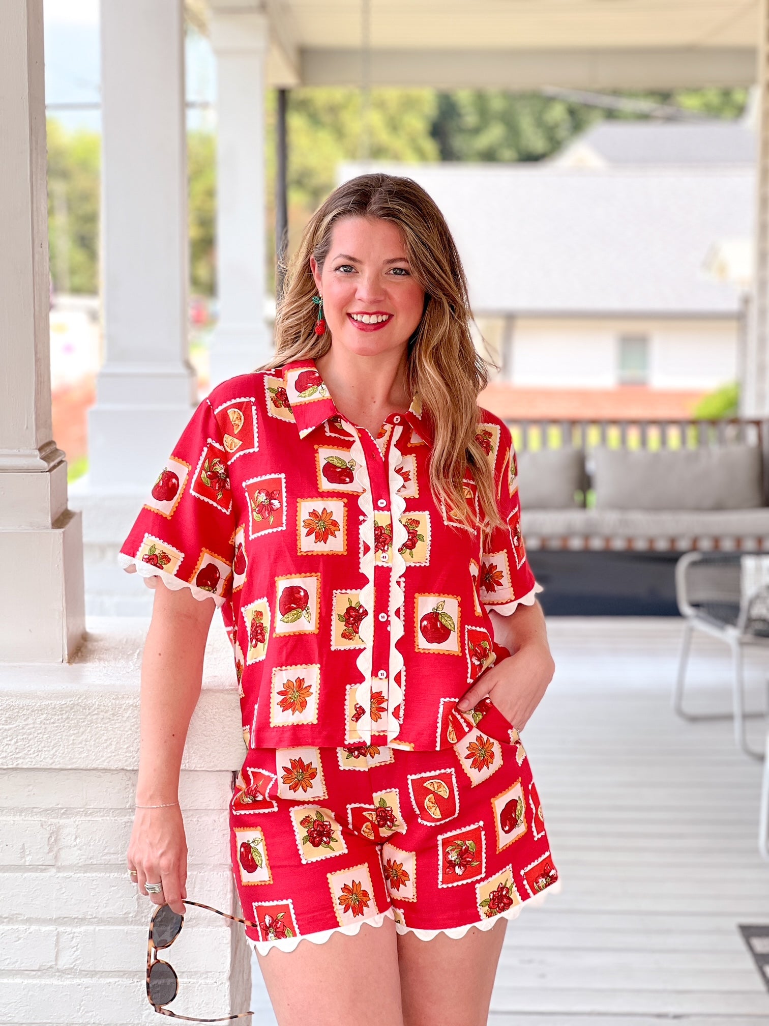 red tomato pattern shorts wit white scalloped end