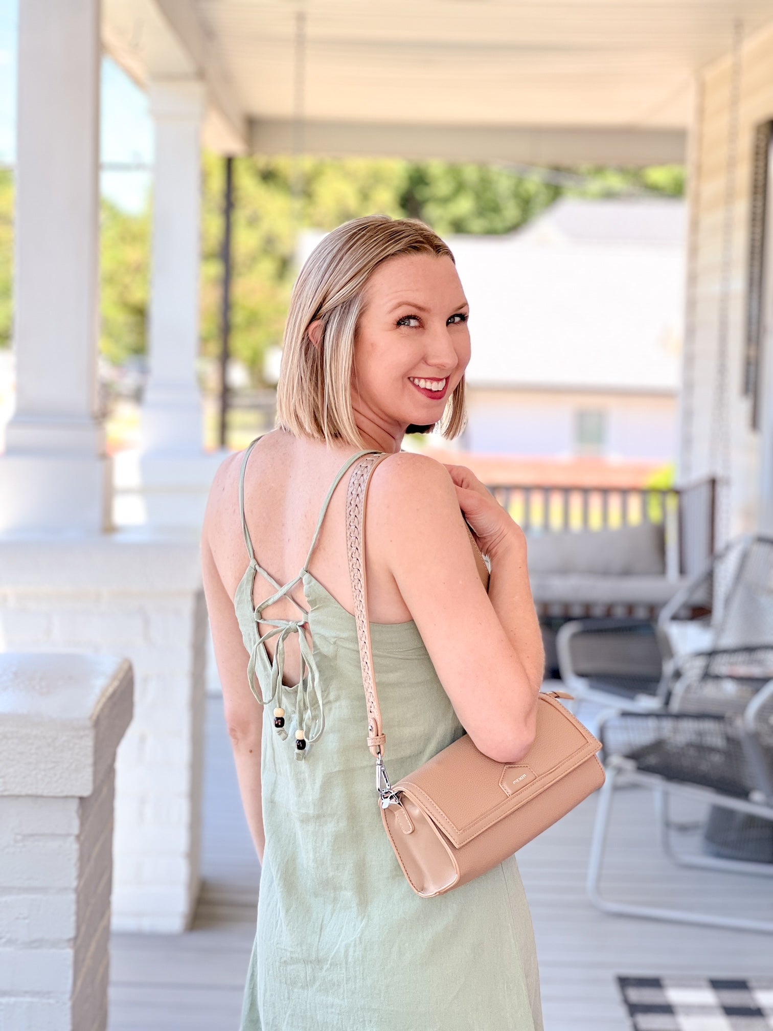 light green sleeveless dress with tie back detail
