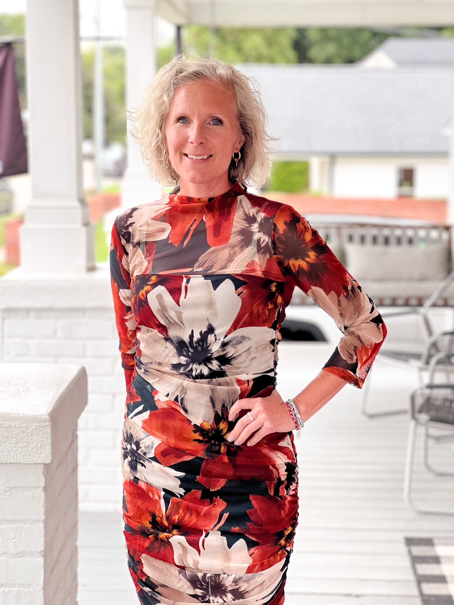 midi length orange, black and cream dress with 3/4 sleeves