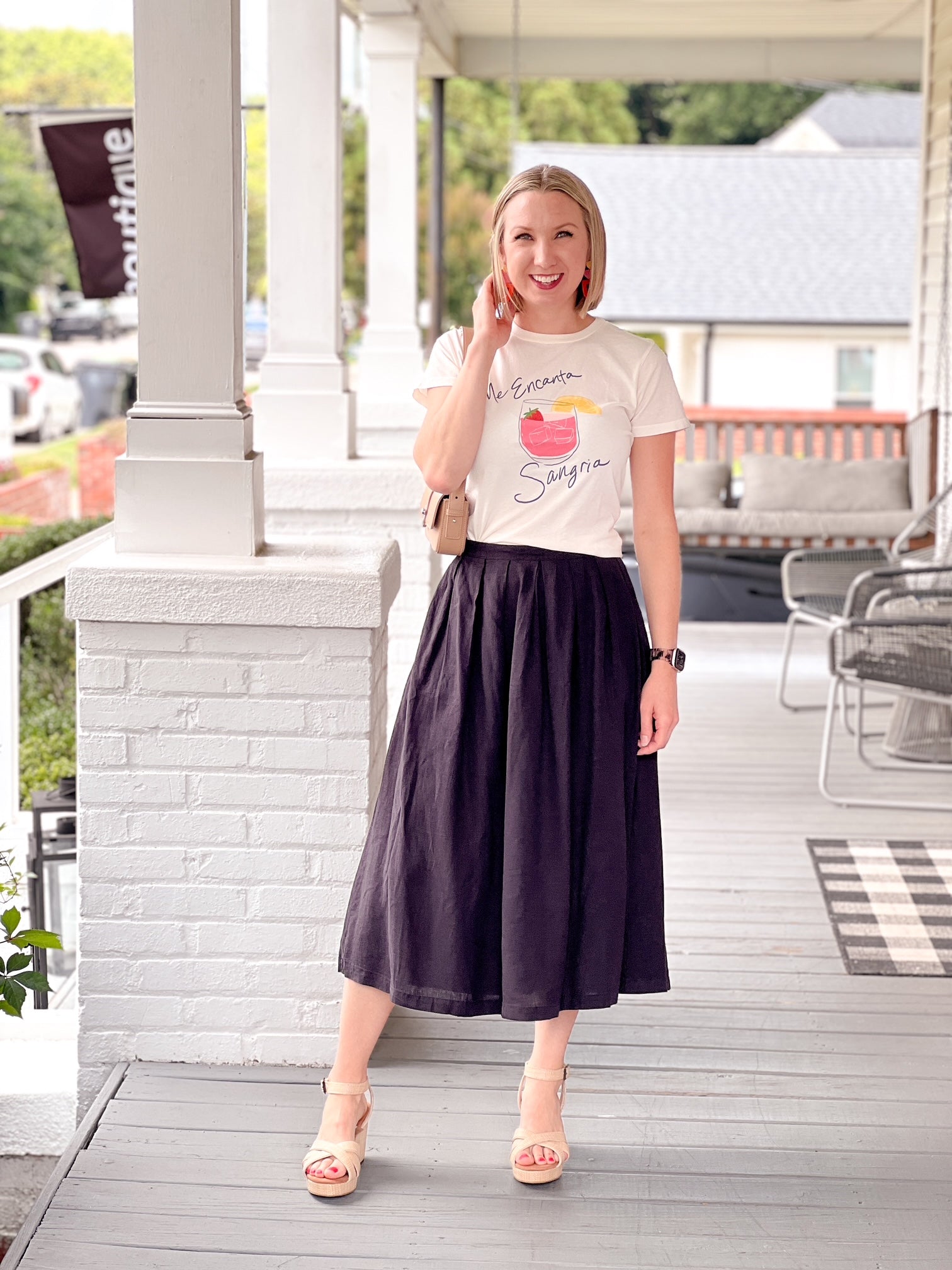 short sleeve white top with glass of sangria