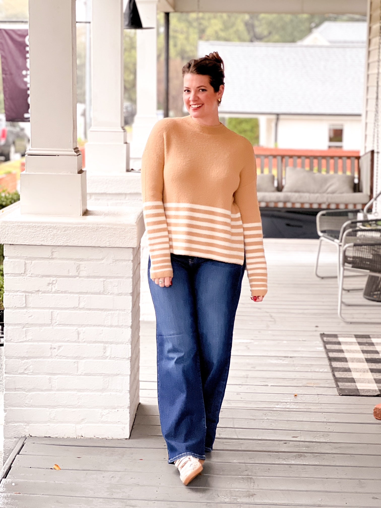 caramel sweater with white stripe detailing on bottom