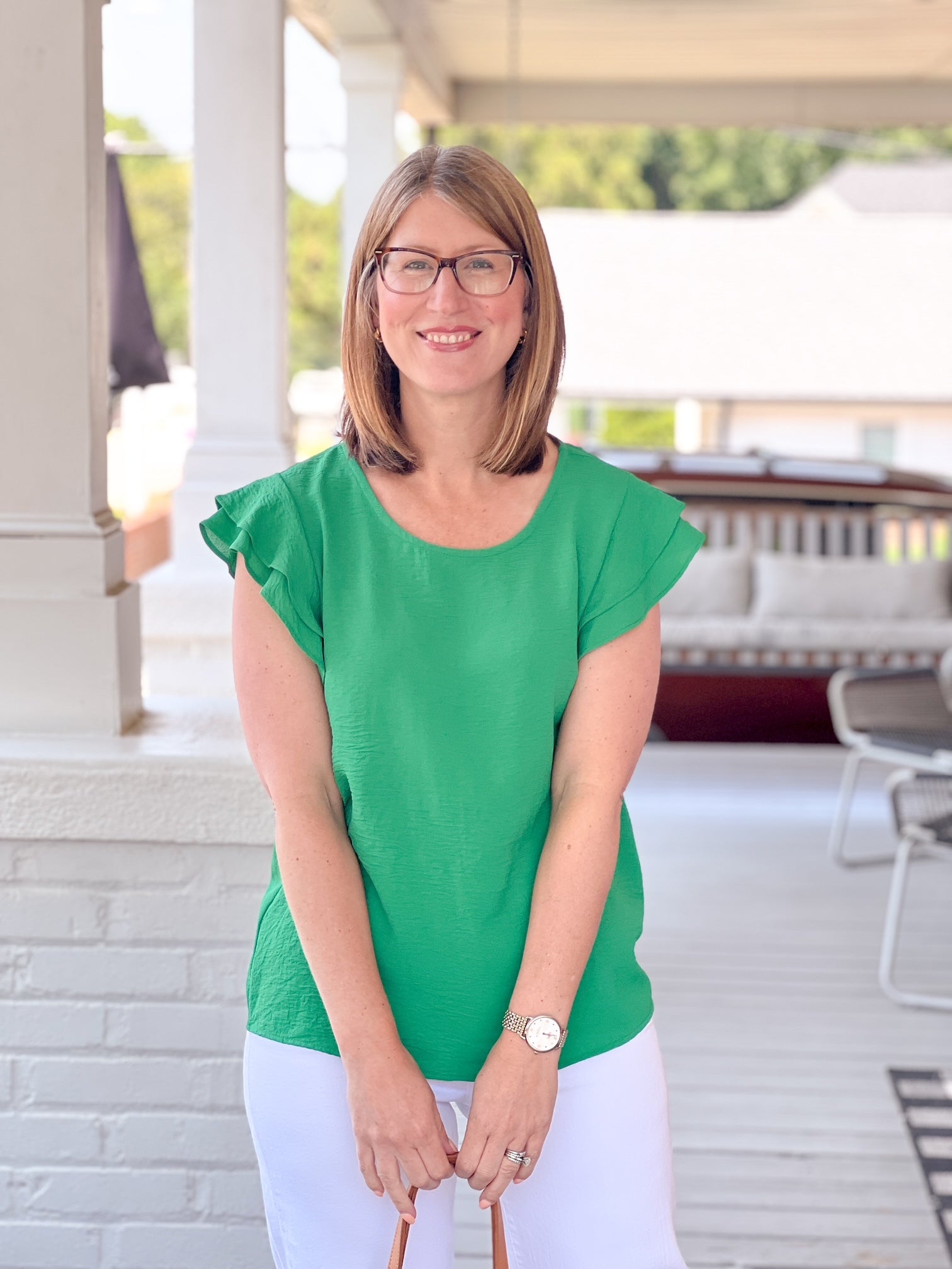 bright green top with short ruffle sleeves and a crew neckline