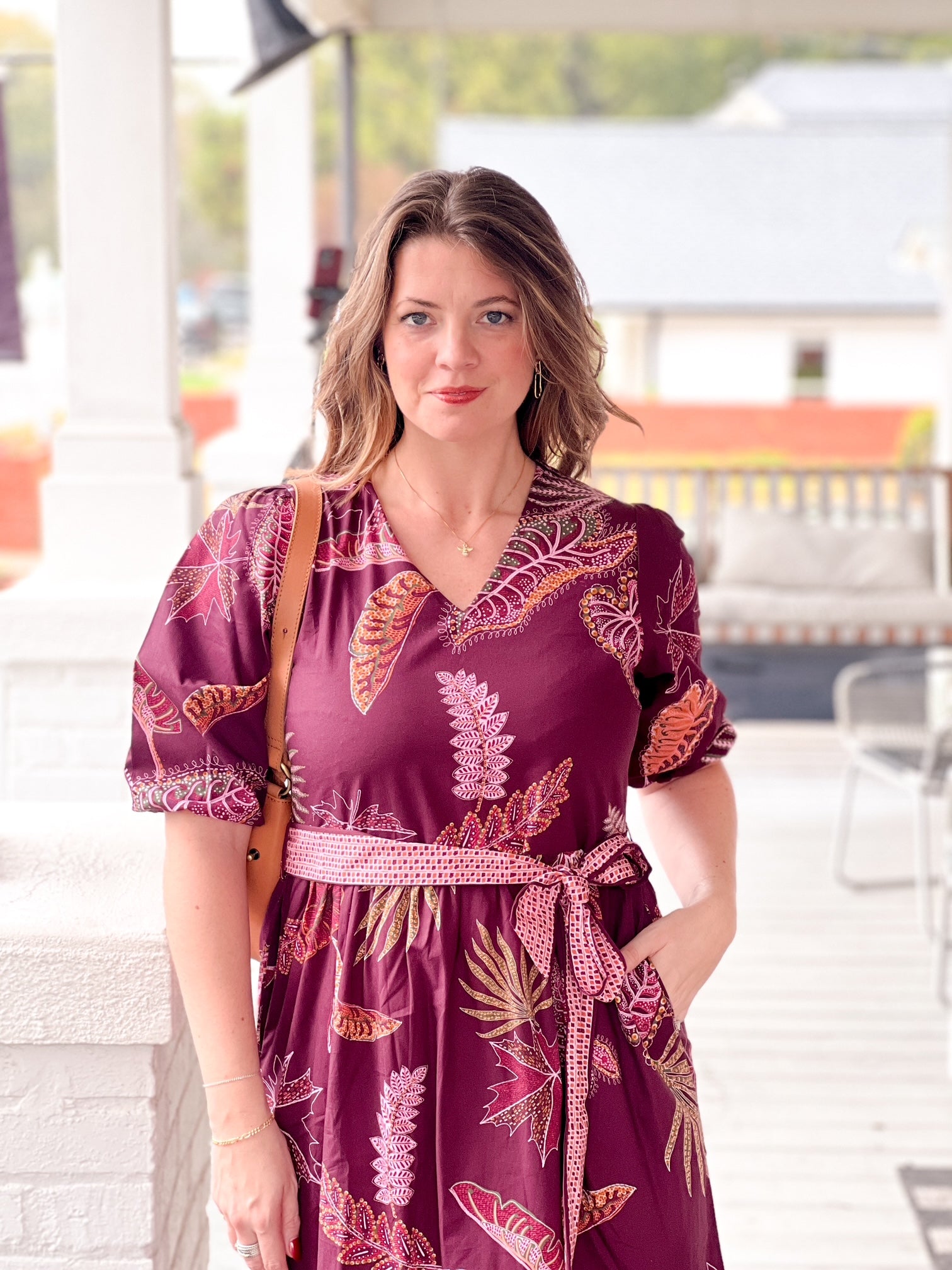 wine colored dress with leaf pattern, v neckline, a line fit