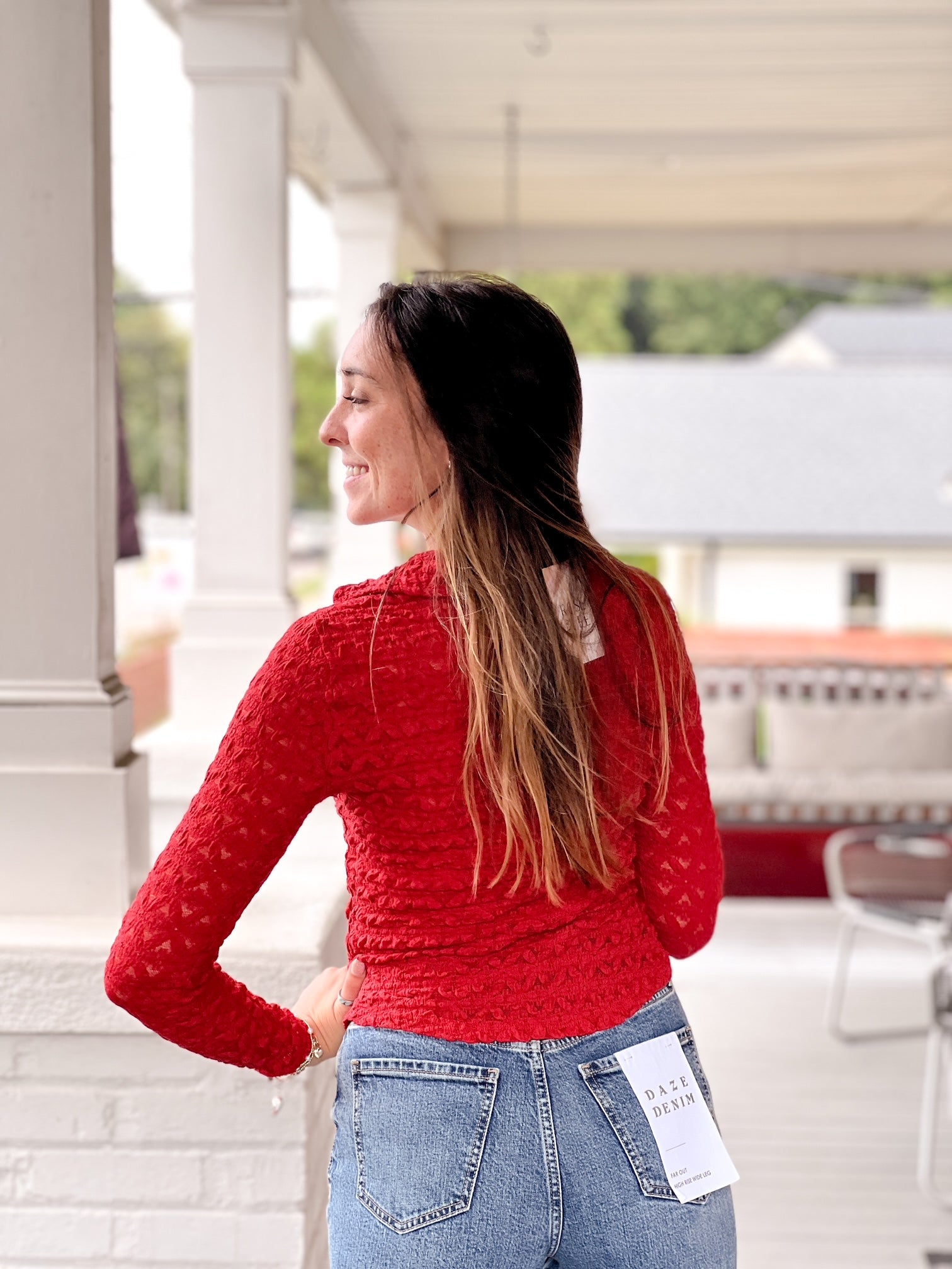 red long sleeve collared v neckline button front top