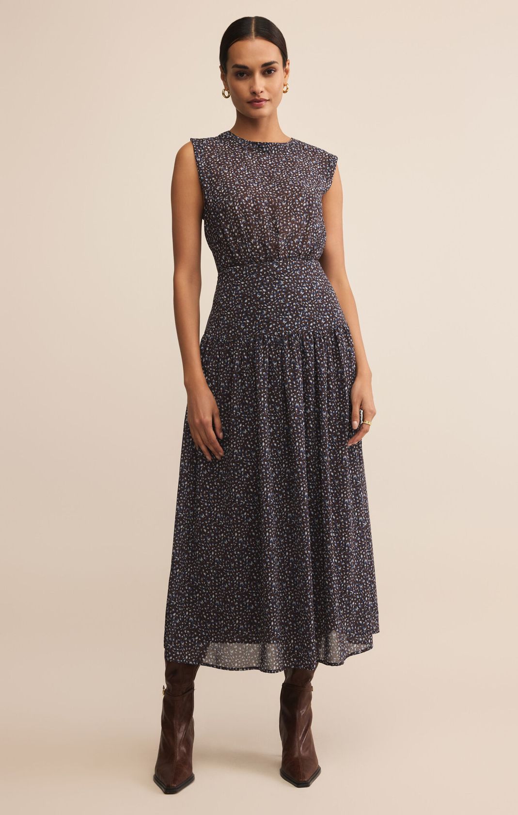 dark blue maxi length dress with small floral pattern, fitted at waist, sleeveless