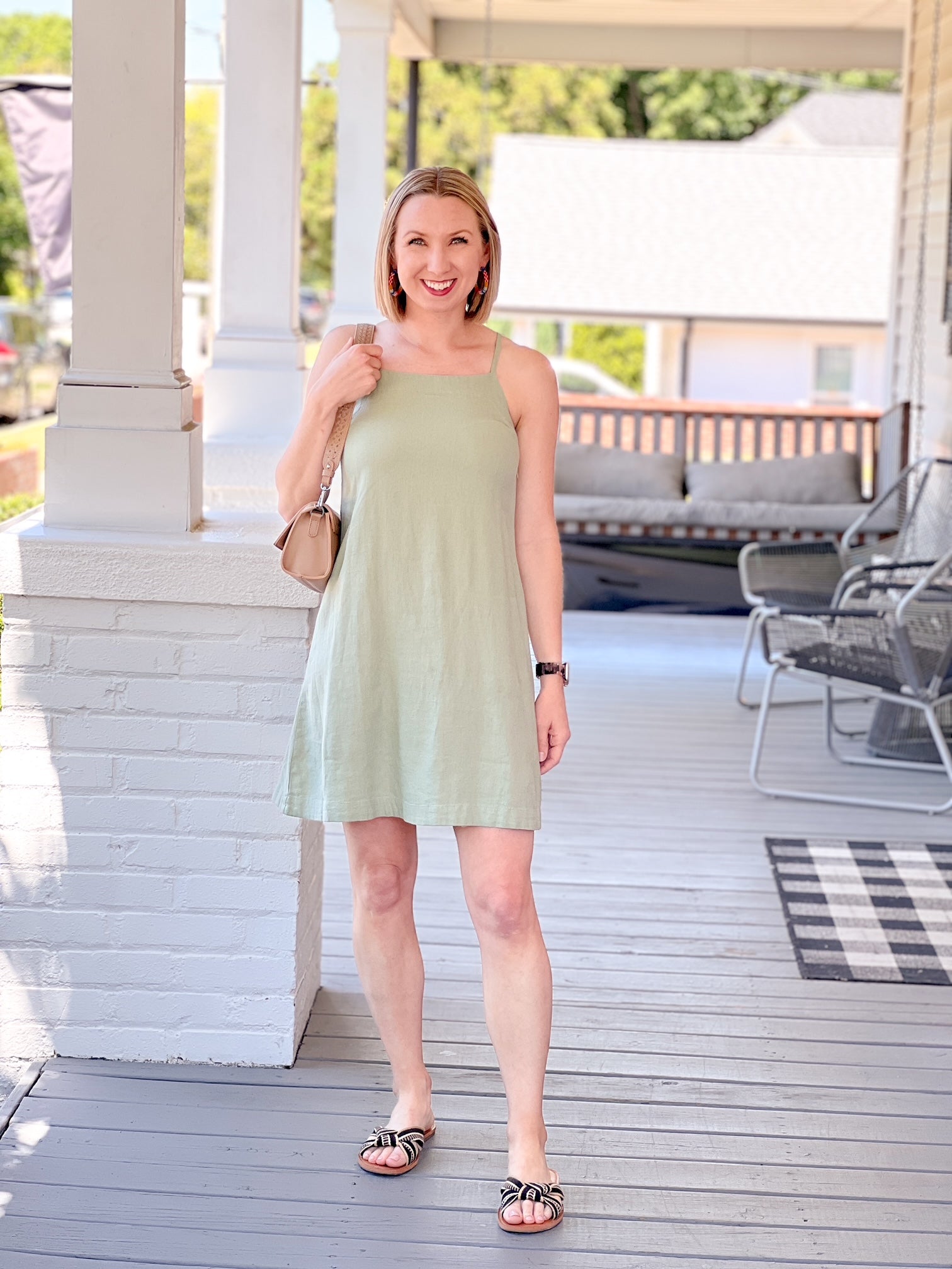 light green sleeveless dress with tie back detail
