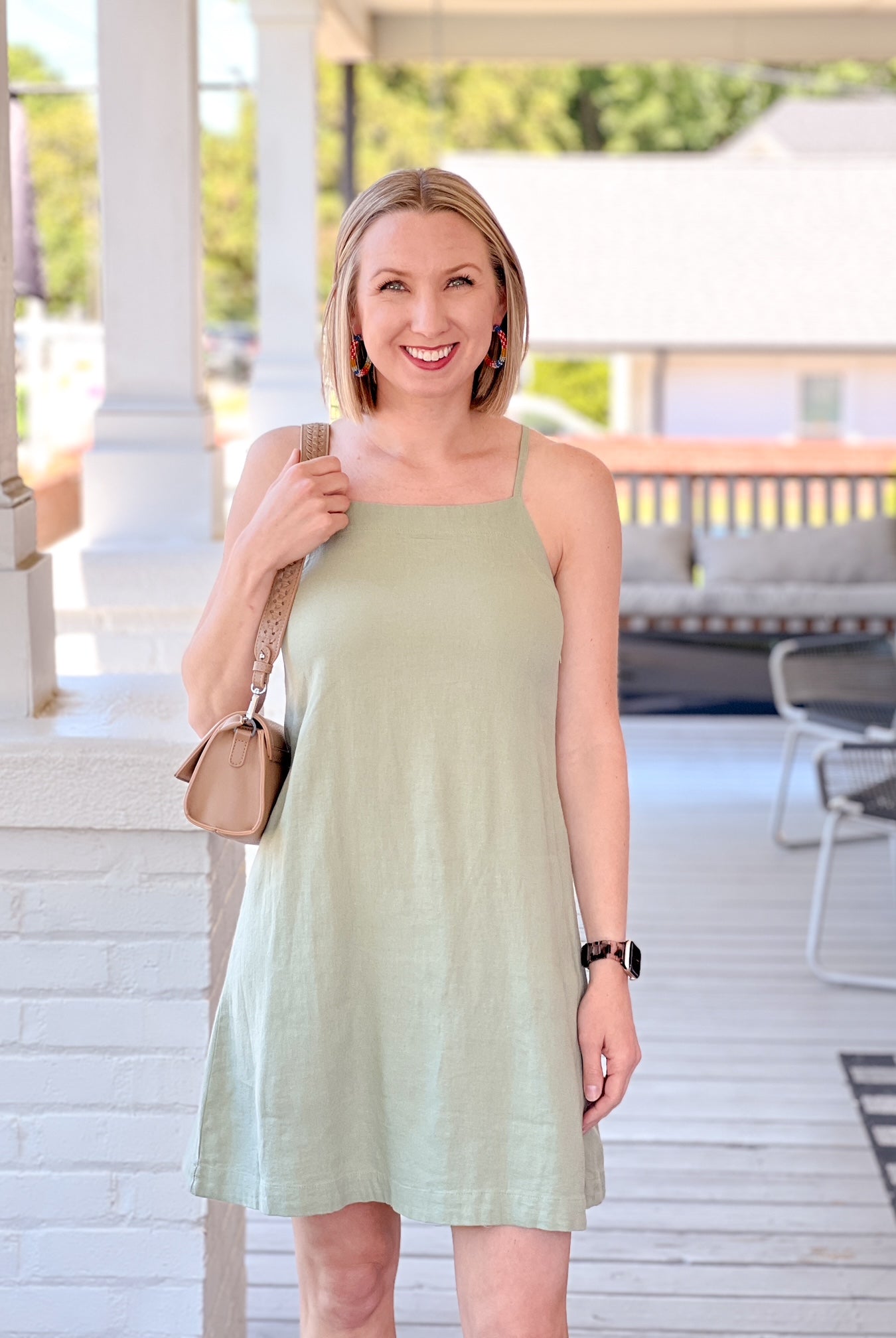 light green sleeveless dress with tie back detail