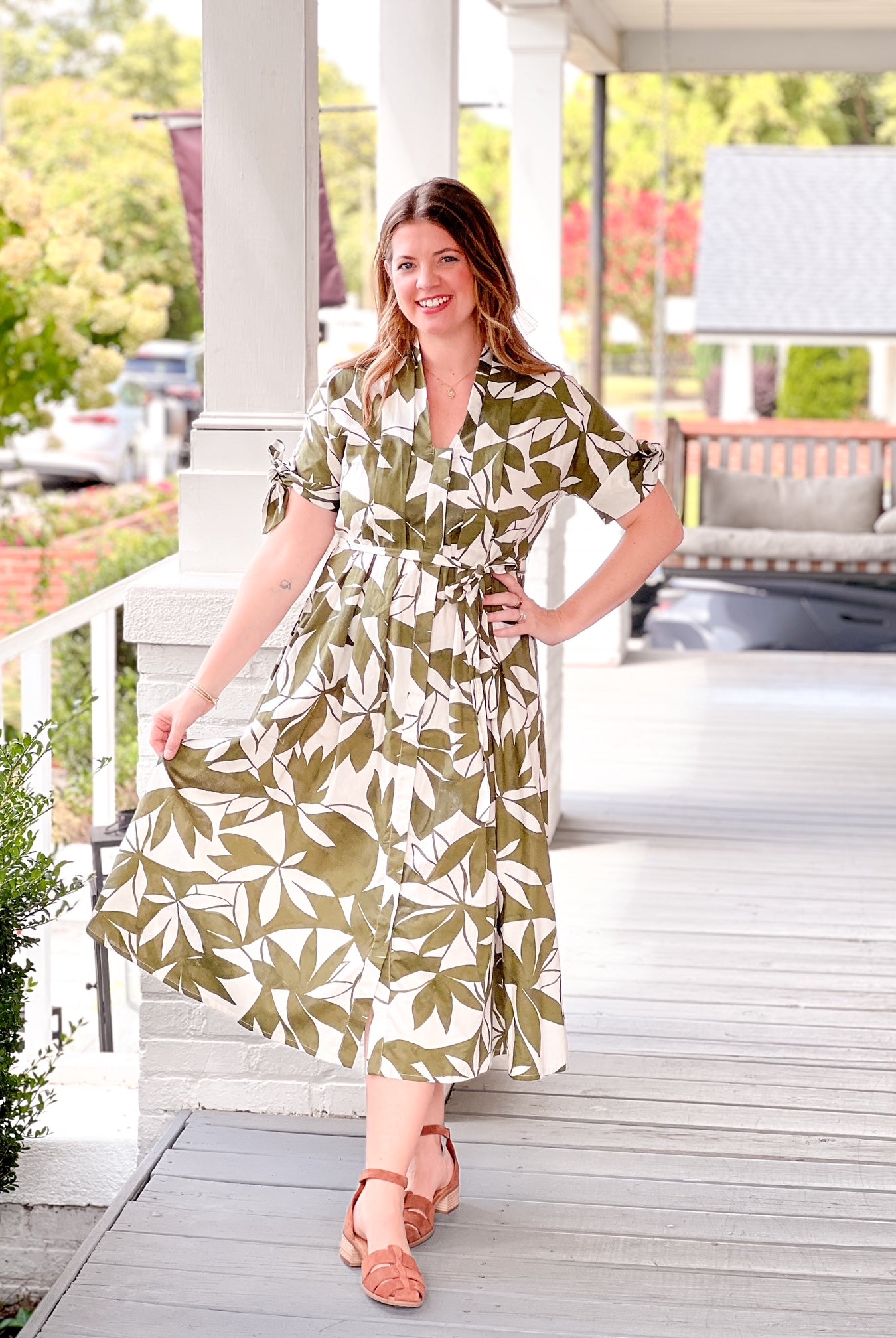 olive green dress with short sleeves, midi length, leaf pattern