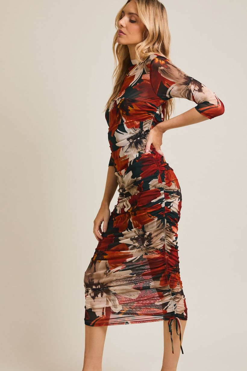 midi length orange, black and cream dress with 3/4 sleeves