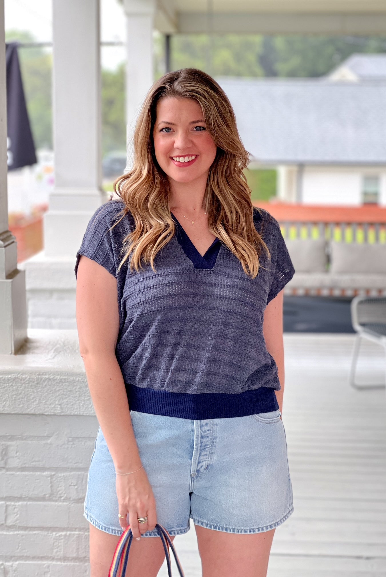 short sleeve navy top with v neckline