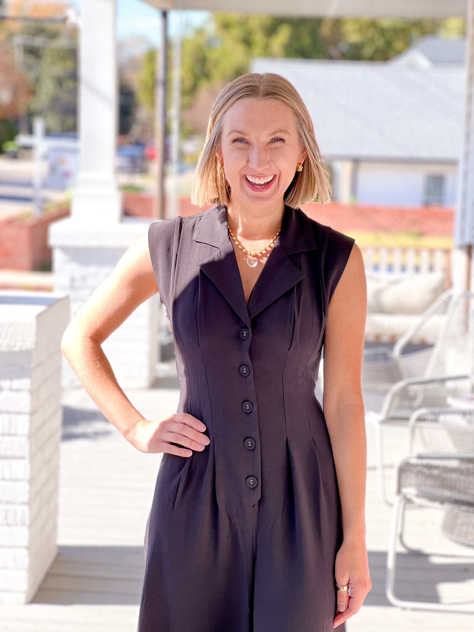 long sleeve black jumpsuit with button up front and collar