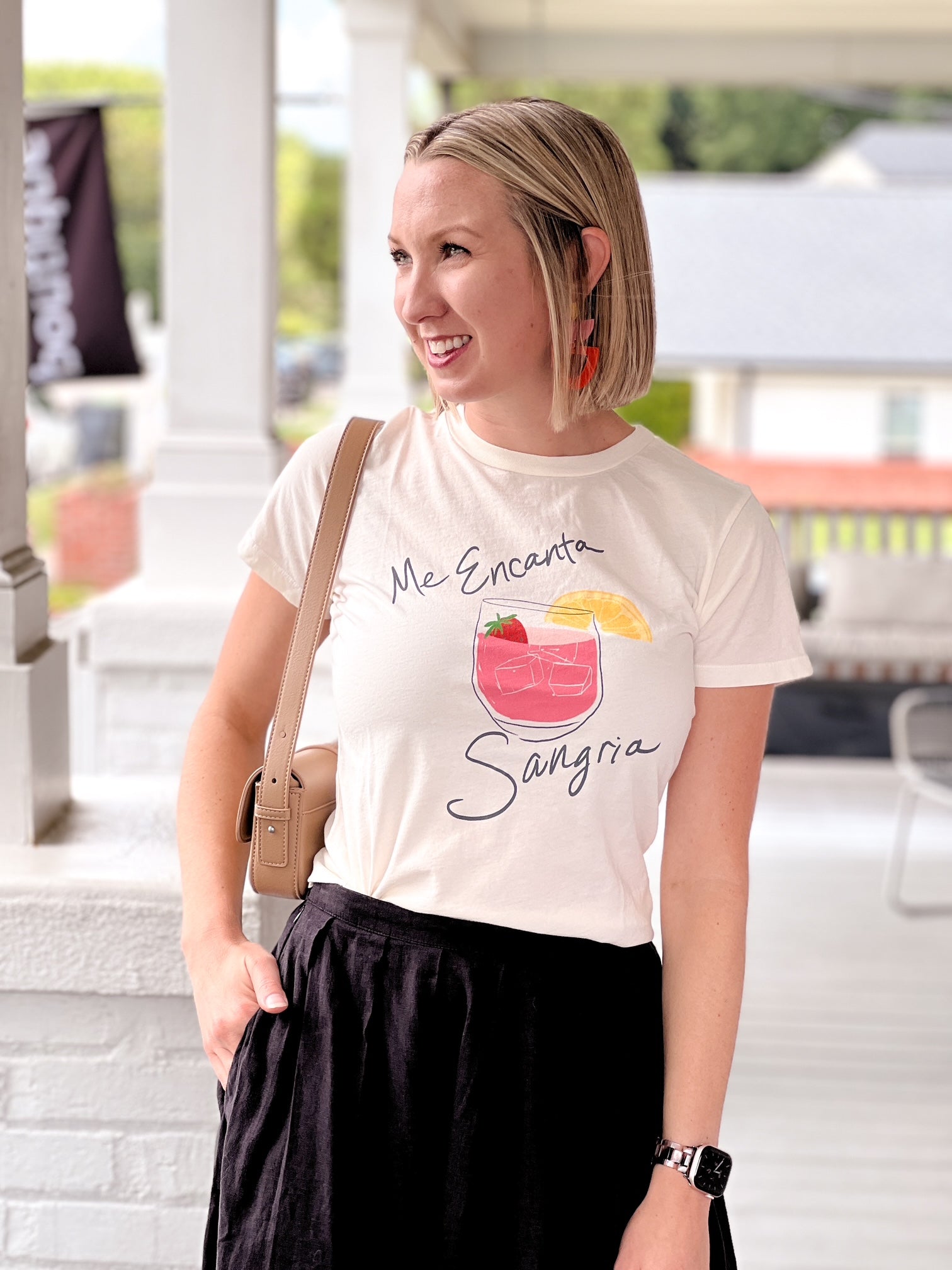 short sleeve white top with glass of sangria