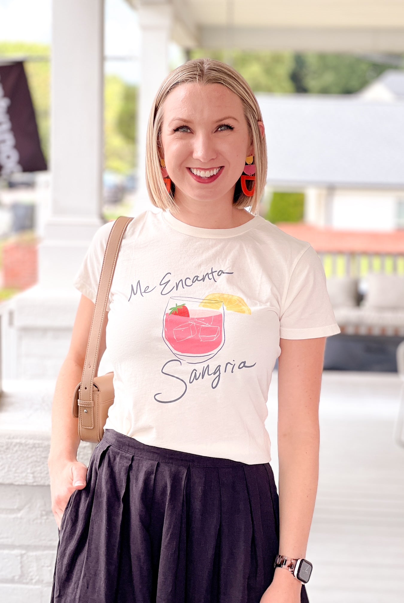 short sleeve white top with glass of sangria