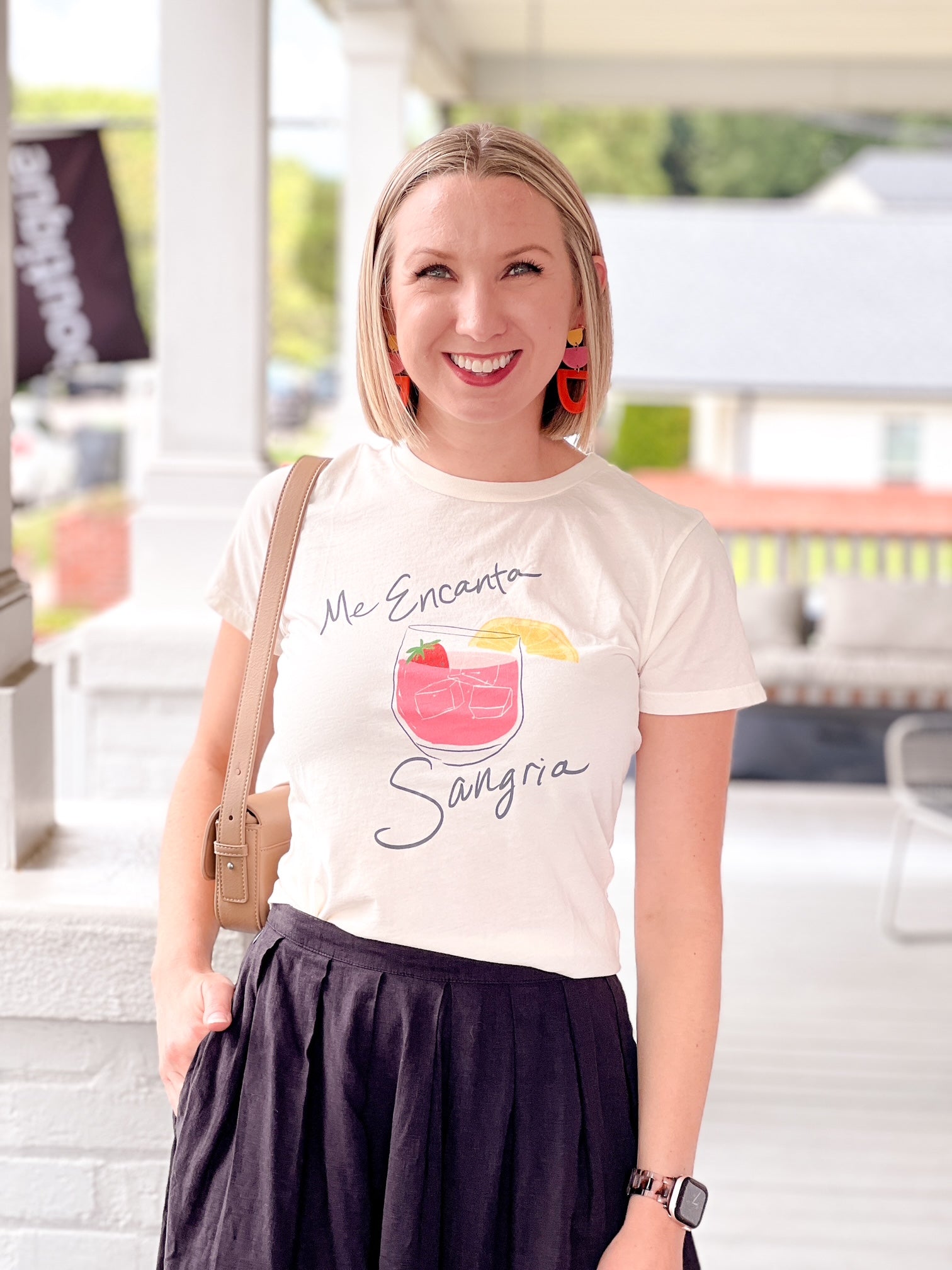 short sleeve white top with glass of sangria