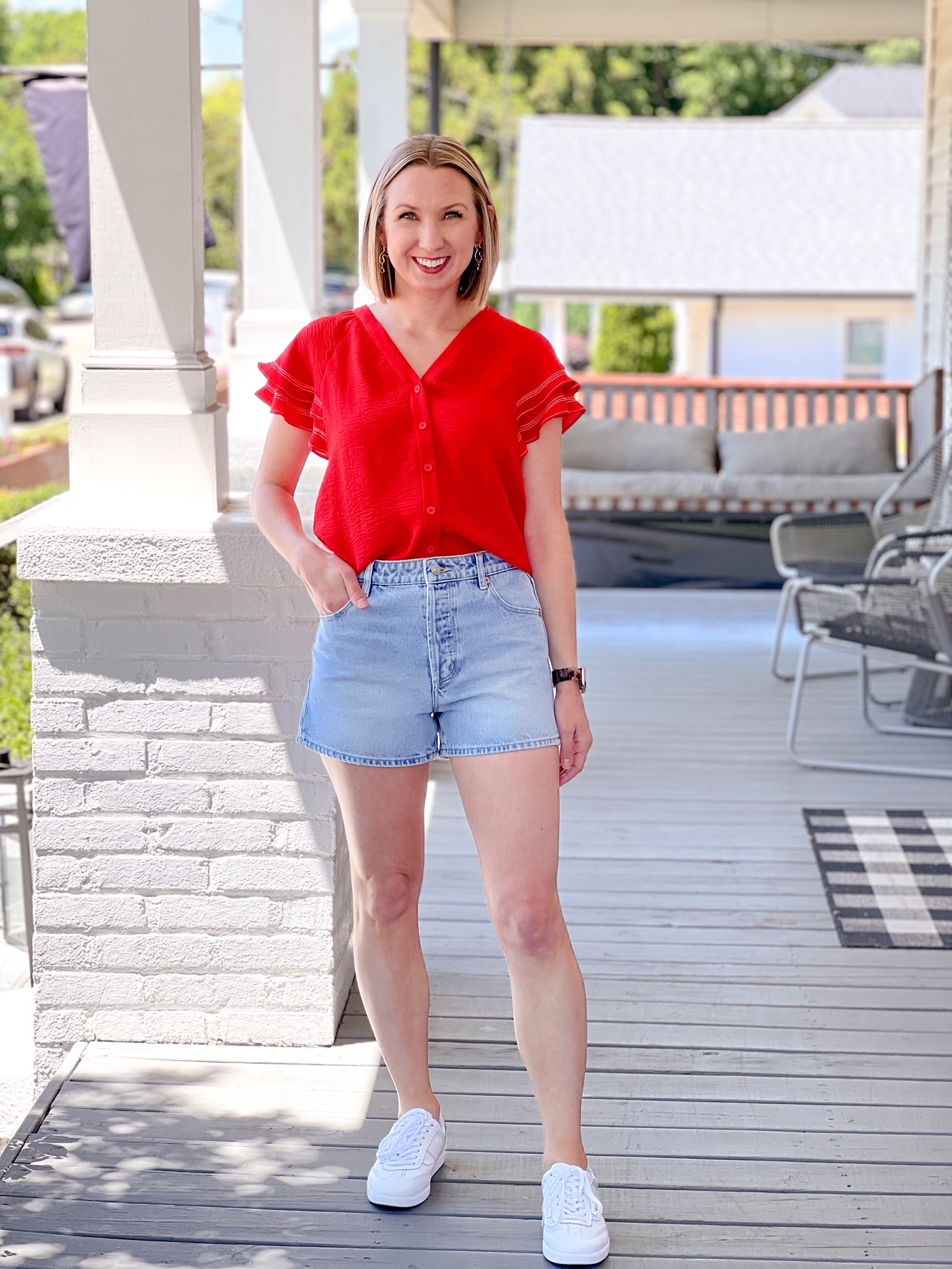 lightweight, short sleeve red top with button up detail and ruffle sleeves