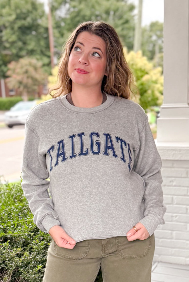 reversible grey hoodie with tailgate written on one side and touchdown written on the other