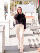 long sleeve brown cardigan with crew neckline and contrasting hem