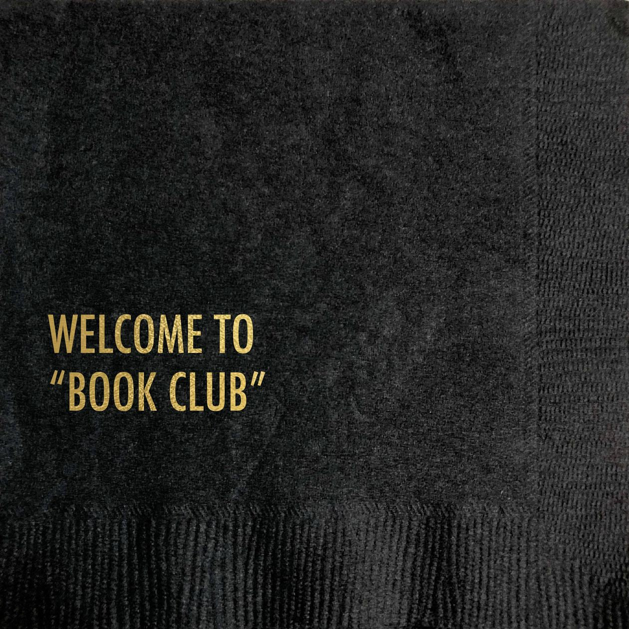 black napkin with "welcome to 'book club'" written on it
