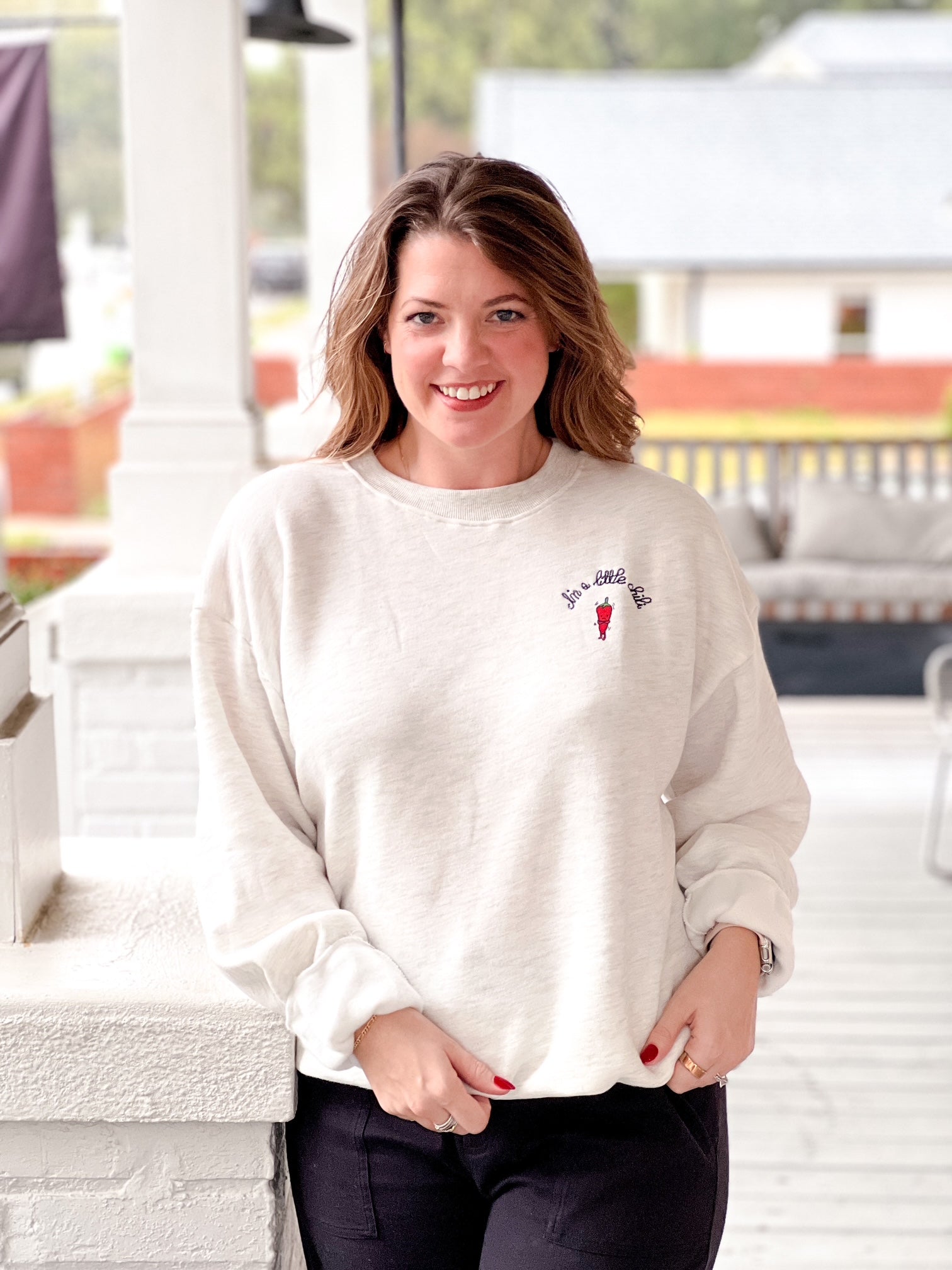 sweatshirt with red chili and "I'm a little chili" written on front left 