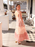 maxi length dress with pink floral pattern