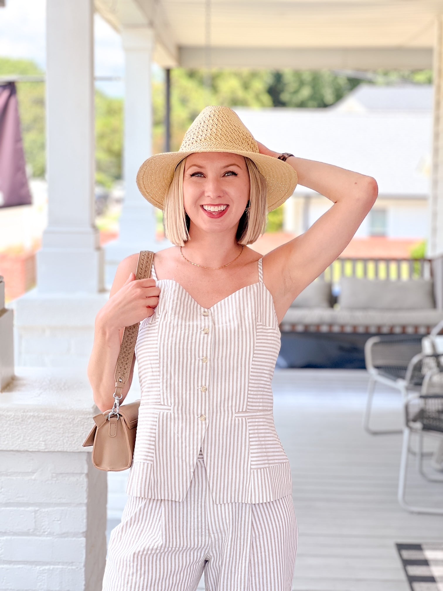 sleeveless striped top with v neckline and front button detail