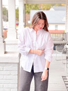 white button up top with gold stripes