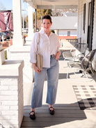 white button up top with gold stripes