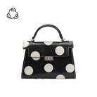 black handbag with large white polka dots
