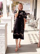 black midi length short sleeve dress with colorful embroidery 