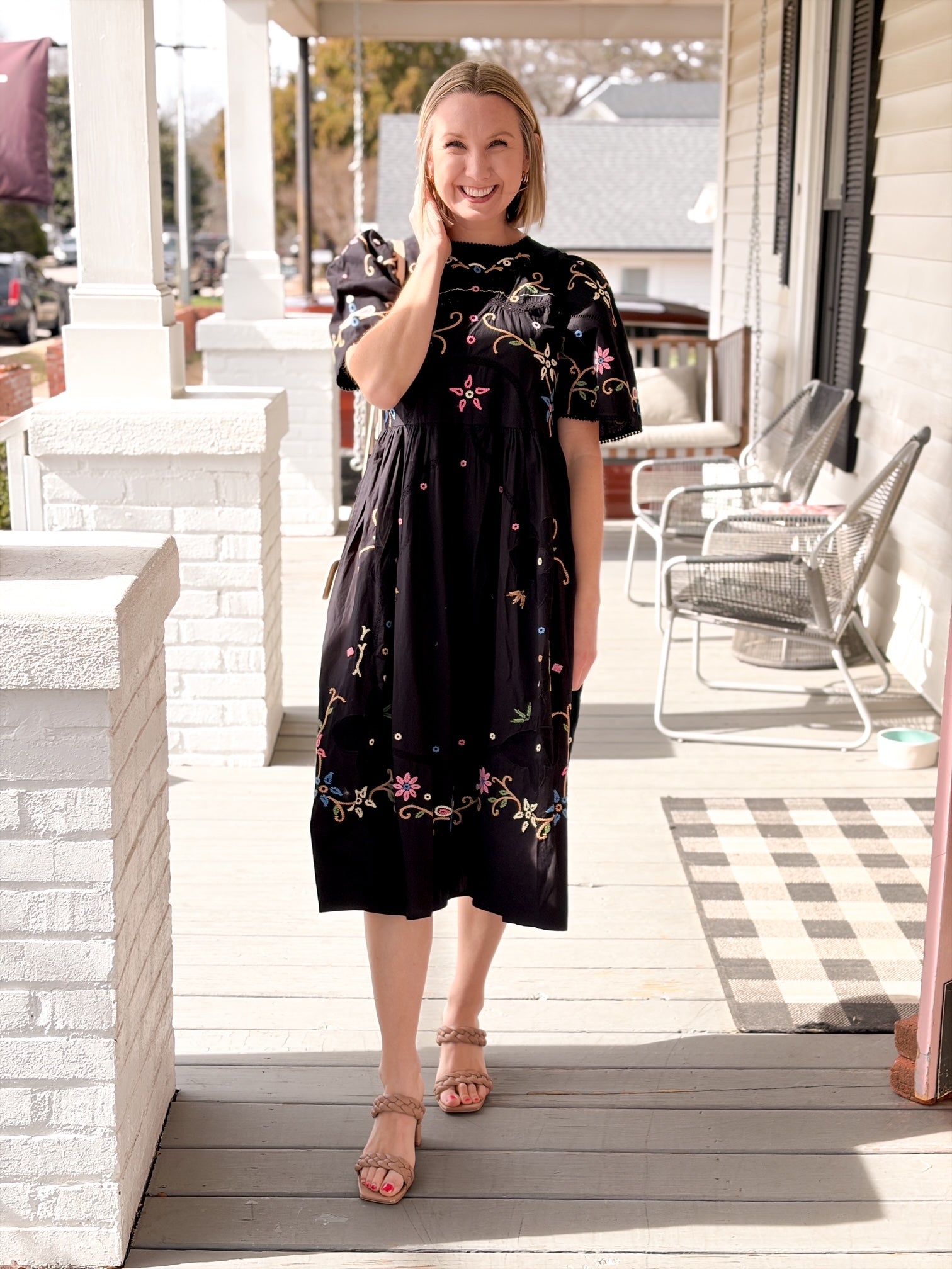 black midi length short sleeve dress with colorful embroidery 