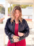 black bomber jacket with rose pattern