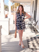 navy romper with white eyelet detailing