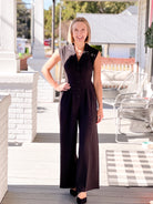 long sleeve black jumpsuit with button up front and collar