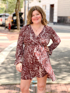 brown and cream patterned mini dress with v neckline