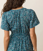 midi length a line dress with v neckline, teal floral pattern, short sleeves